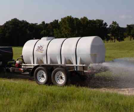 Truck Hauling 1000 Gallon Water Trailer Dust Abatement