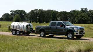 Truck Hauling 1000 Gallon Water Wagon