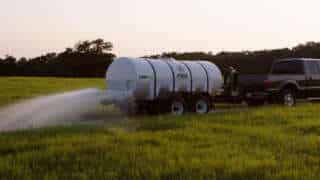 Truck Hauling 1600 Gallon D.O.T. Water Trailer Dust Abatement