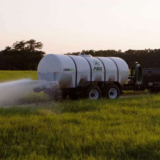 Truck Hauling 1600 Gallon D.O.T. Water Trailer Dust Abatement