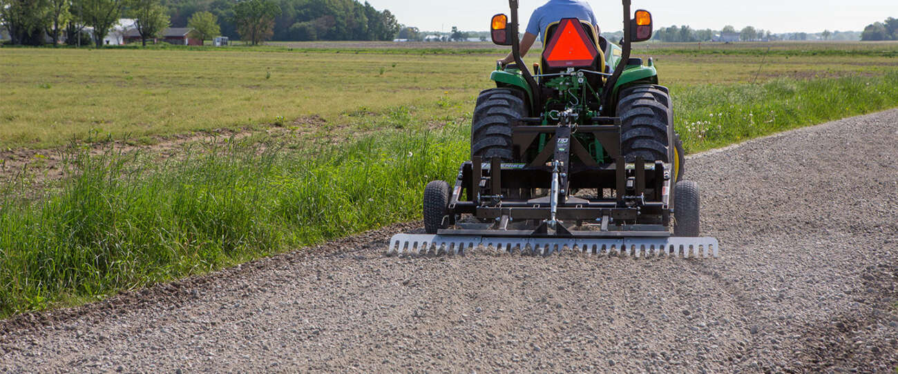 3 Tips For Grading Gravel Lots & Driveways ABI Attachments