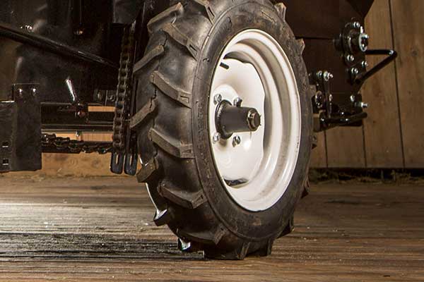 An image of a Ground Drive Manure Spreader drive tire and chain.