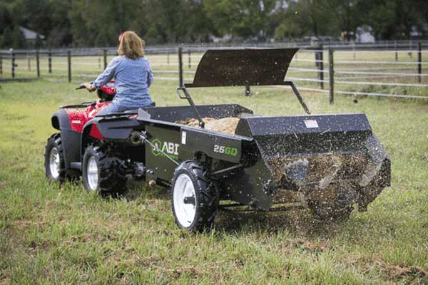 A Ground Drive Manure Spreader pulled by an ATV